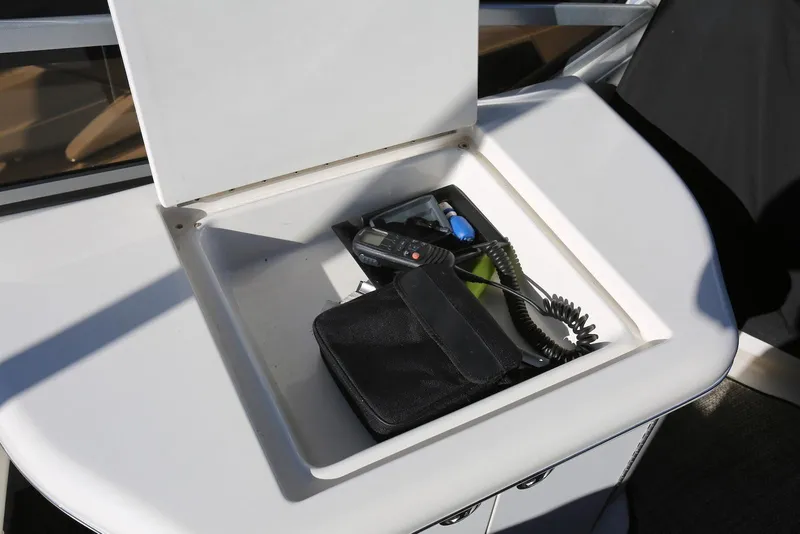 Slide: The Image of Storage compartment on 2004 Sea Ray 420 Sedan Bridge with radio and accessories. - 52