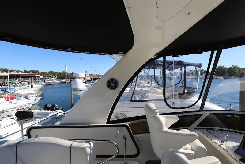 Slide: The Image of 2004 Sea Ray 420 Sedan Bridge yacht interior with marina view. - 59