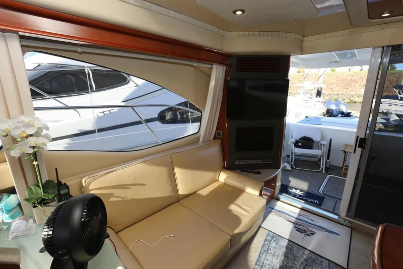 Slide: The Image of Interior of 2004 Sea Ray 420 Sedan Bridge yacht with beige seating and modern amenities. - 70