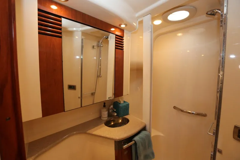 Slide: The Image of Luxurious bathroom in 2004 Sea Ray 420 Sedan Bridge yacht with modern fixtures. - 90