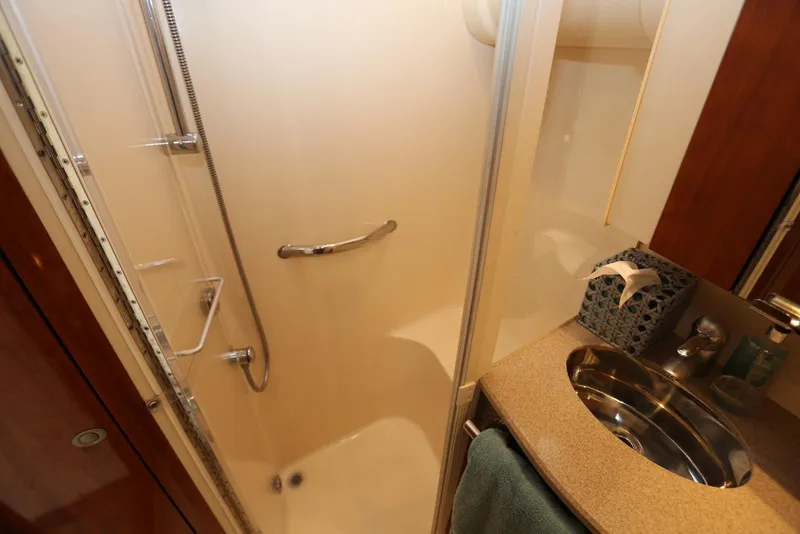 Slide: The Image of Luxurious bathroom in 2004 Sea Ray 420 Sedan Bridge yacht with shower and sink. - 92