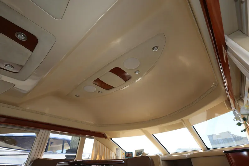 Slide: The Image of Interior ceiling of 2004 Sea Ray 420 Sedan Bridge yacht with modern design elements. - 97
