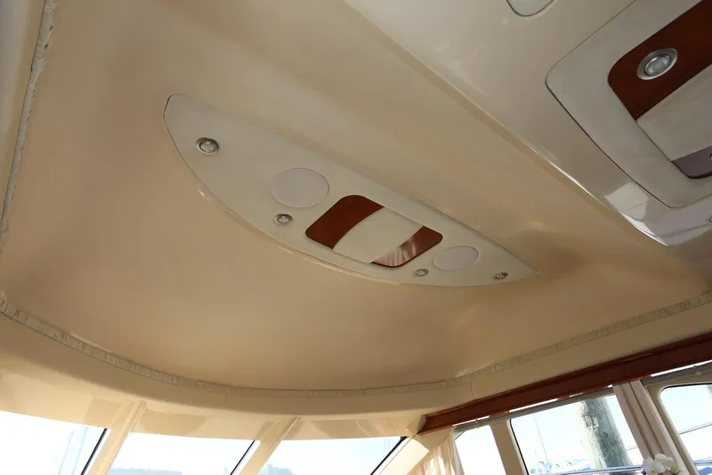 Slide: The Image of Interior ceiling of 2004 Sea Ray 420 Sedan Bridge yacht with modern lighting fixtures. - 99