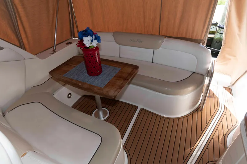 Slide: The Image of Luxurious interior of 2009 Sea Ray 310 Sundancer with elegant seating and wooden table. - 2