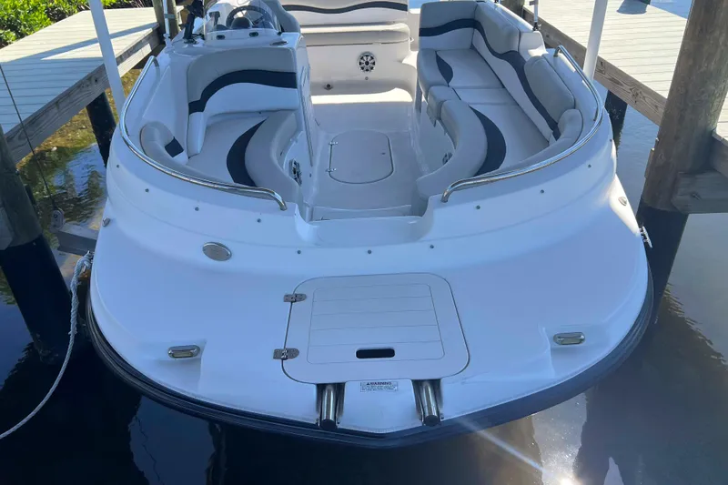 Slide: The Image of 2018 Starcraft SVX 190 OB boat docked, featuring spacious seating and sleek design. - 12