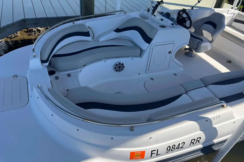 Slide: The Image of 2018 Starcraft SVX 190 OB boat interior with cushioned seating and steering wheel. - 14