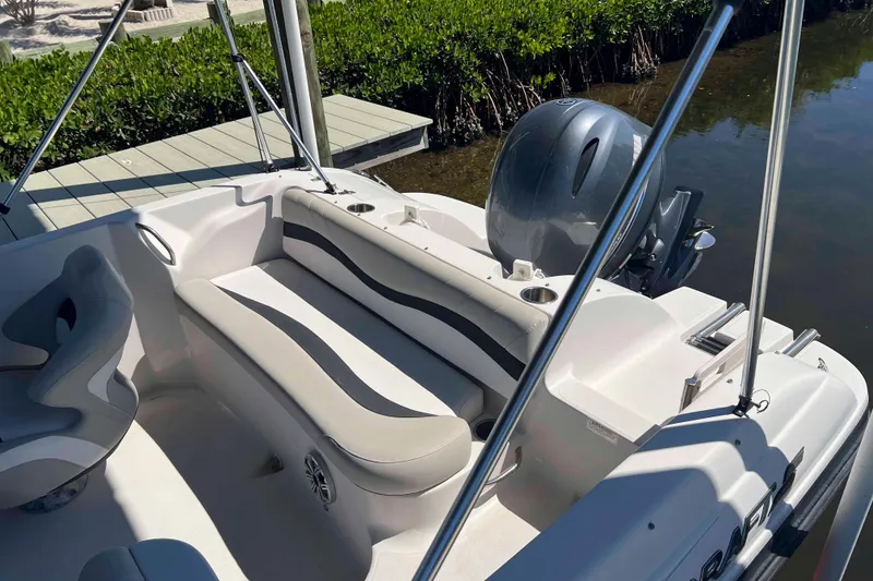 Slide: The Image of 2018 Starcraft SVX 190 OB boat interior with seating and outboard motor. - 16