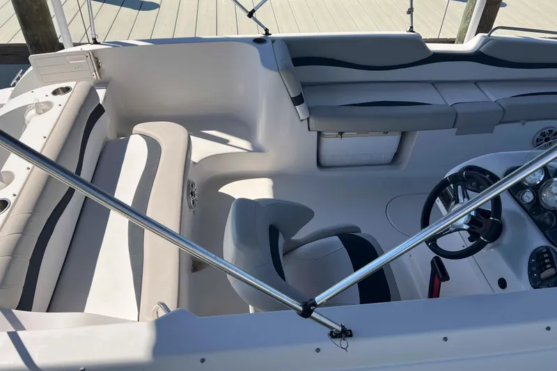 Slide: The Image of 2018 Starcraft SVX 190 OB boat interior with seating and steering wheel. - 19