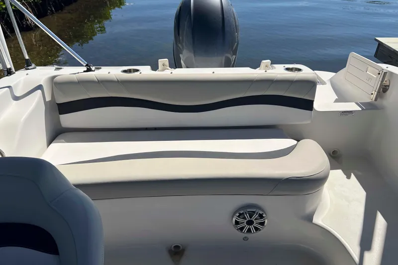 Slide: The Image of 2018 Starcraft SVX 190 OB boat interior with cushioned seating and cup holders. - 23