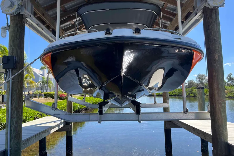 Slide: The Image of 2018 Starcraft SVX 190 OB boat on lift, dockside view. - 6