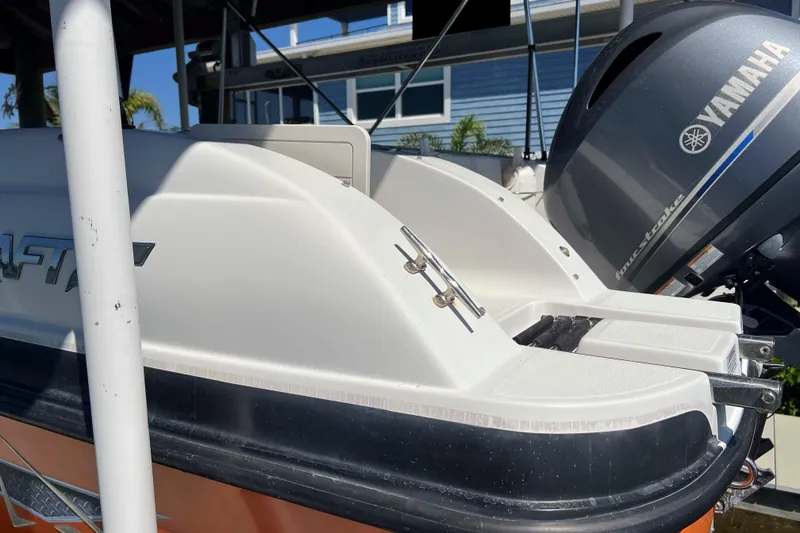 Slide: The Image of 2018 Starcraft SVX 190 OB boat with Yamaha outboard motor, docked under a canopy. - 7