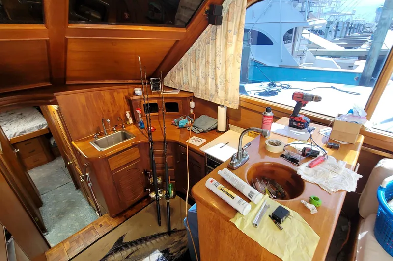 Slide: The Image of Interior of 1984 Tiffany 50 Convertible boat with fishing gear and tools. - 14