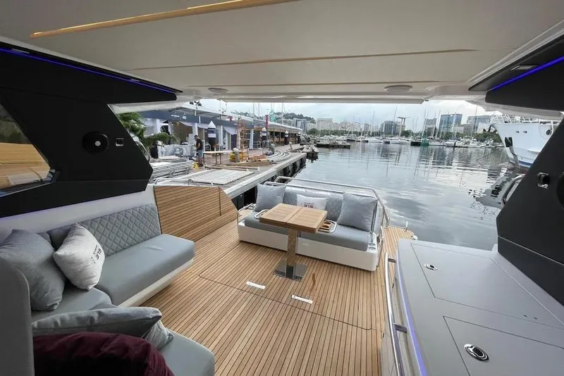 Slide: The Image of Luxurious 2026 Schaefer 375 yacht interior with elegant seating and marina view, Volvo DPI option - 13