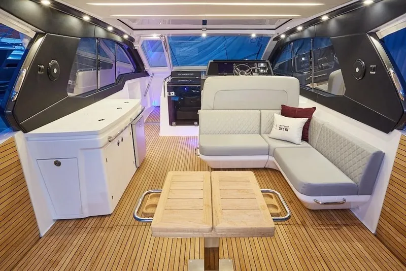 Slide: The Image of Luxurious interior of 2026 Schaefer 375 yacht with modern seating and wooden flooring. - 16