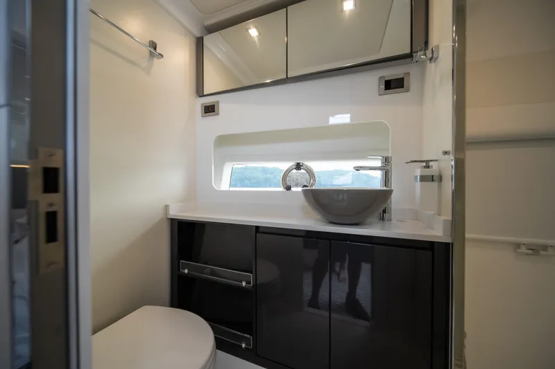 Slide: The Image of Modern bathroom interior on Schaefer 375 yacht, featuring sleek cabinetry and a stylish sink. - 23