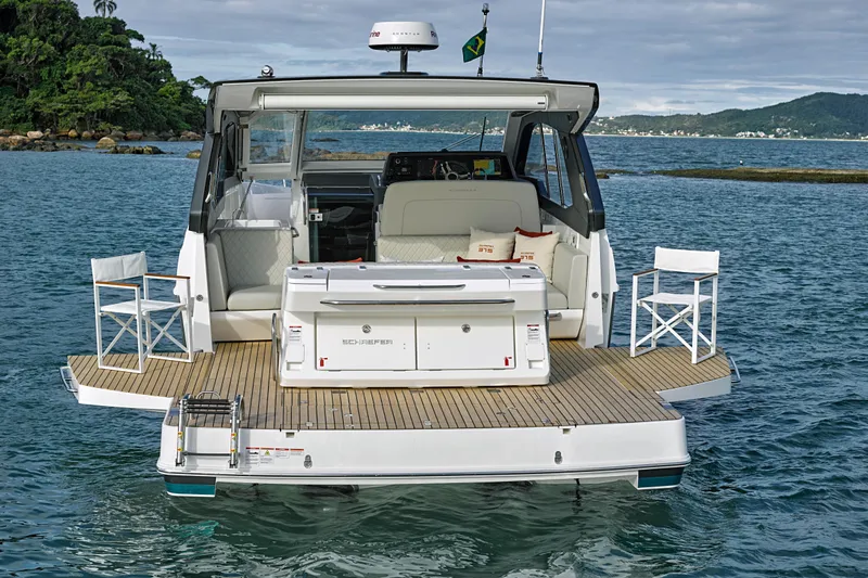 Slide: The Image of 2026 Schaefer 375 yacht with spacious deck and seating on calm waters. - 28