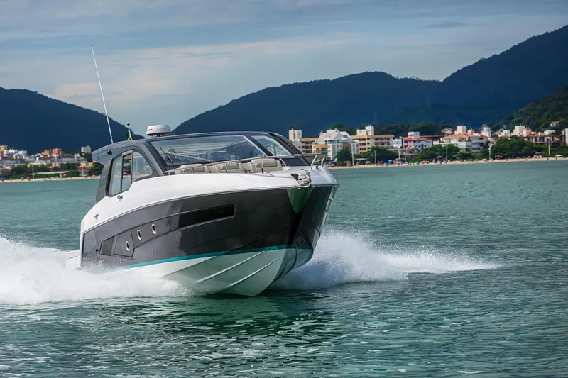 Slide: The Image of 2026 Schaefer 375 yacht cruising on a scenic coastal waterway. - 4