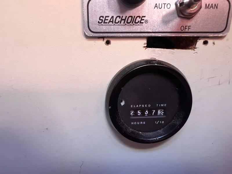 Slide: The Image of Elapsed time meter showing 2557.2 hours on Ericson 38, 1981 model. - 10