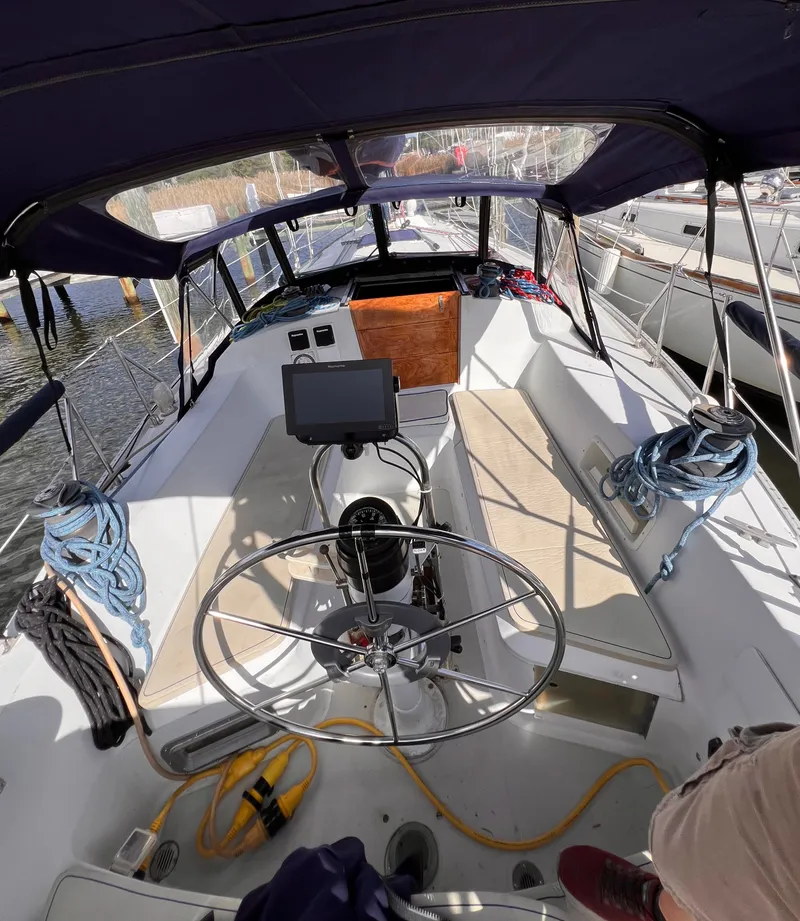 Slide: The Image of Cockpit of 1981 Ericson 38 sailboat with steering wheel and navigation equipment. - 7