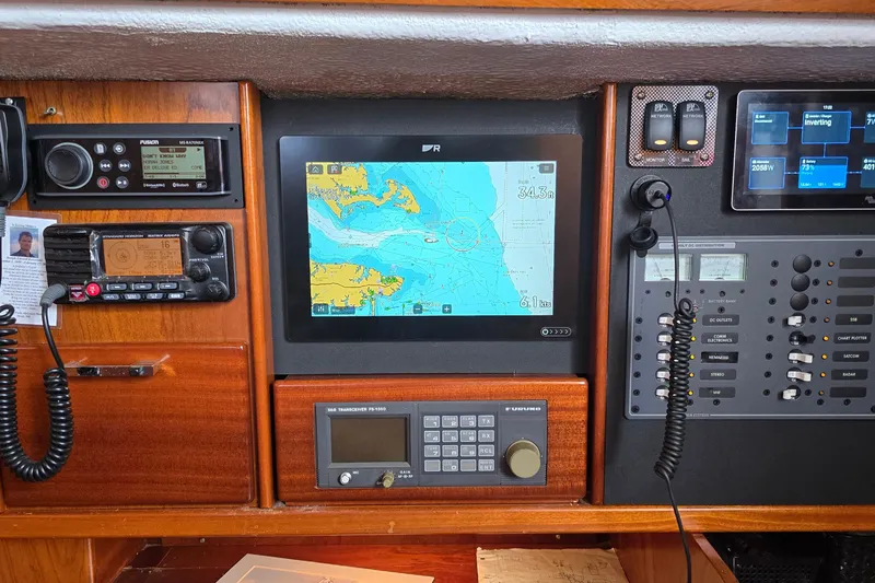 Slide: The Image of Navigation equipment on a 1993 Amel Santorin sailboat, featuring a central GPS display. - 18