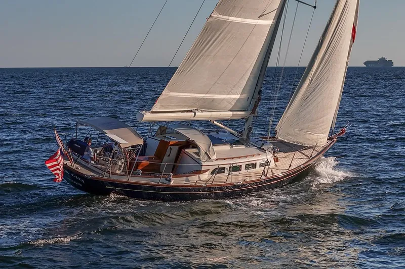 The Image of Sailing Morris Yachts M42, 2007 model, on open sea with American flag. - 1