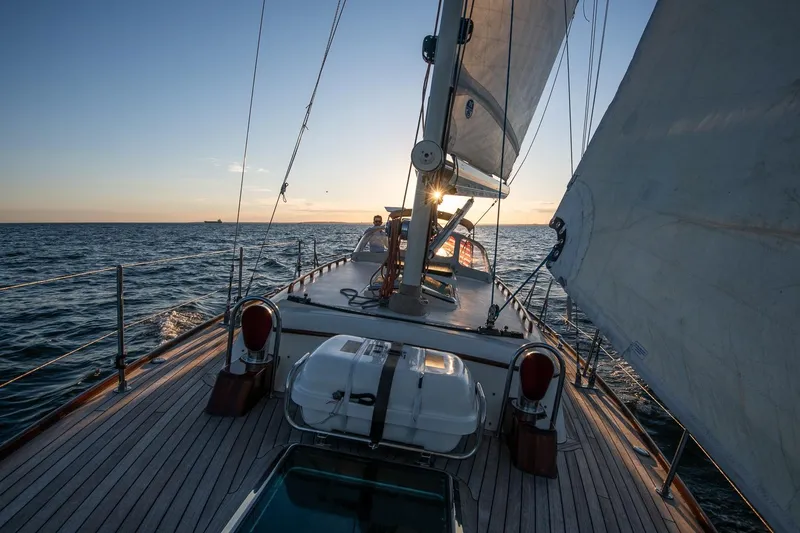 Slide: The Image of Sailing on a 2007 Morris Yachts M42 at sunset, open sea view. - 13