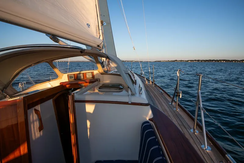 Slide: The Image of 2007 Morris Yachts M42 sailing on calm waters at sunset. - 16