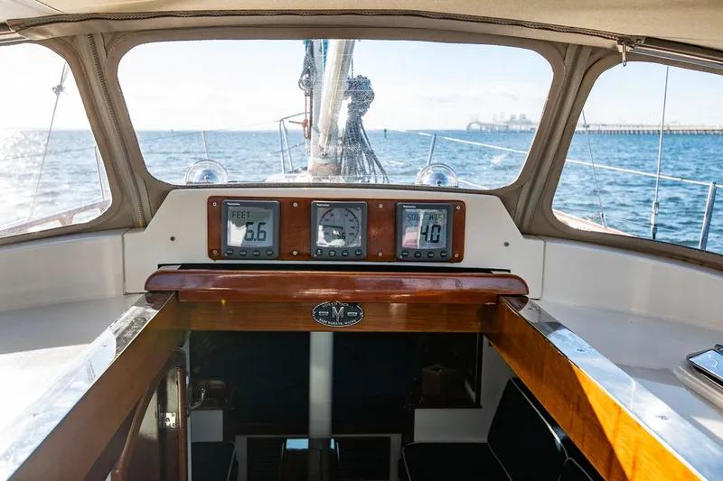 Slide: The Image of Cockpit view of 2007 Morris Yachts M42 sailboat with navigation instruments and ocean backdrop. - 17