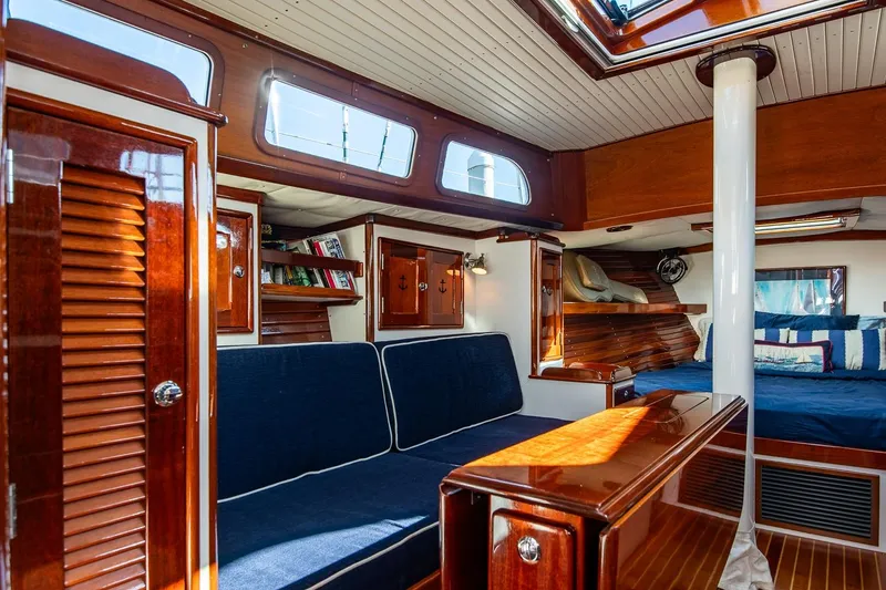 Slide: The Image of Luxurious 2007 Morris Yachts M42 interior with elegant wood finish and cozy seating area. - 20