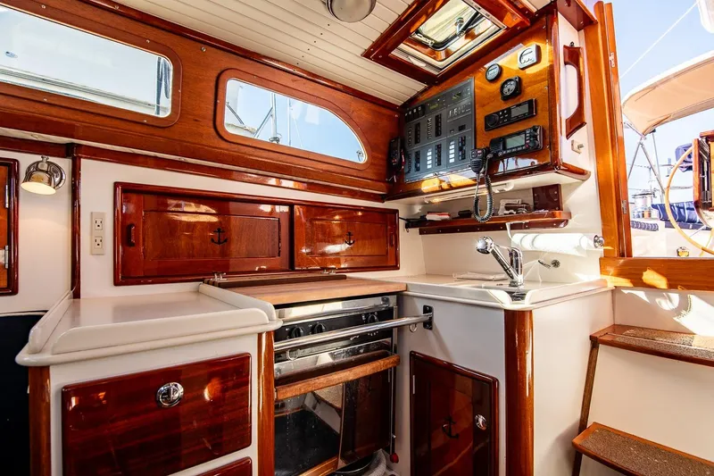 Slide: The Image of Luxurious 2007 Morris Yachts M42 interior with wood finish and modern navigation equipment. - 21