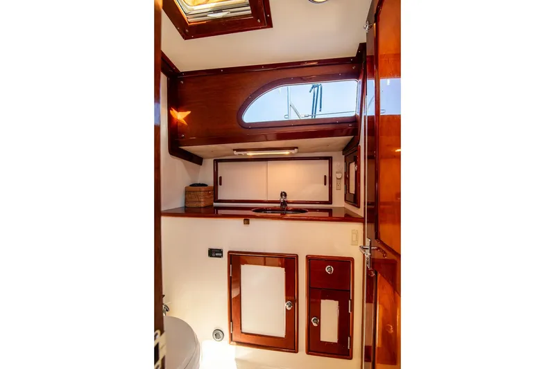 Slide: The Image of Luxurious 2007 Morris Yachts M42 interior with elegant wood cabinetry and modern fixtures. - 22