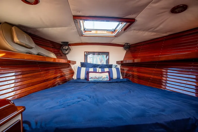 Slide: The Image of Luxurious cabin interior of 2007 Morris Yachts M42 with polished wood and skylight. - 24
