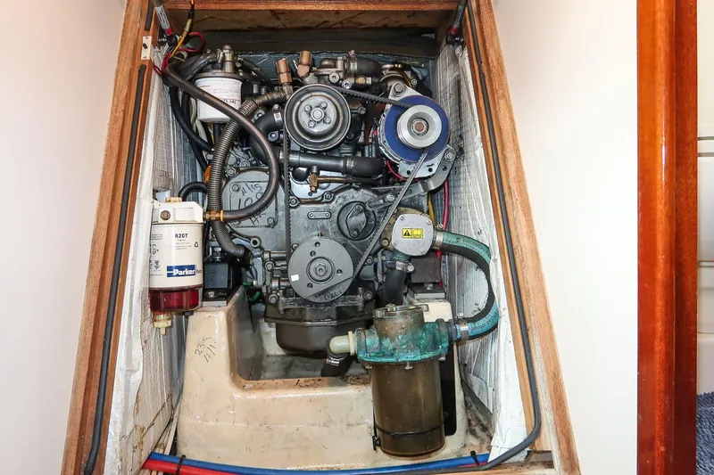 Slide: The Image of Engine compartment of a 2007 Morris Yachts M42, showcasing detailed mechanical components. - 29