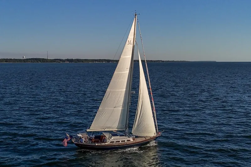 Slide: The Image of Sailing yacht Morris M42, 2007 model, gliding on open water under clear skies. - 31