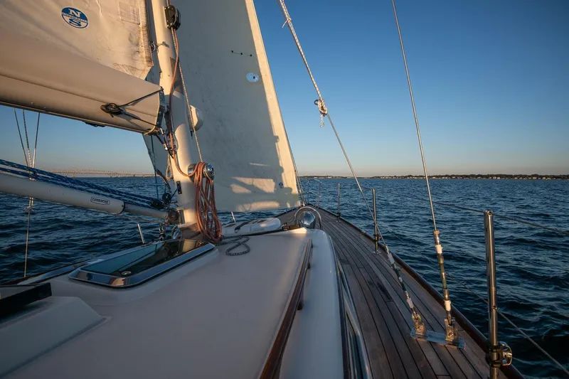 Slide: The Image of Sailing on a 2007 Morris Yachts M42, wooden deck, open sea, clear sky. - 8
