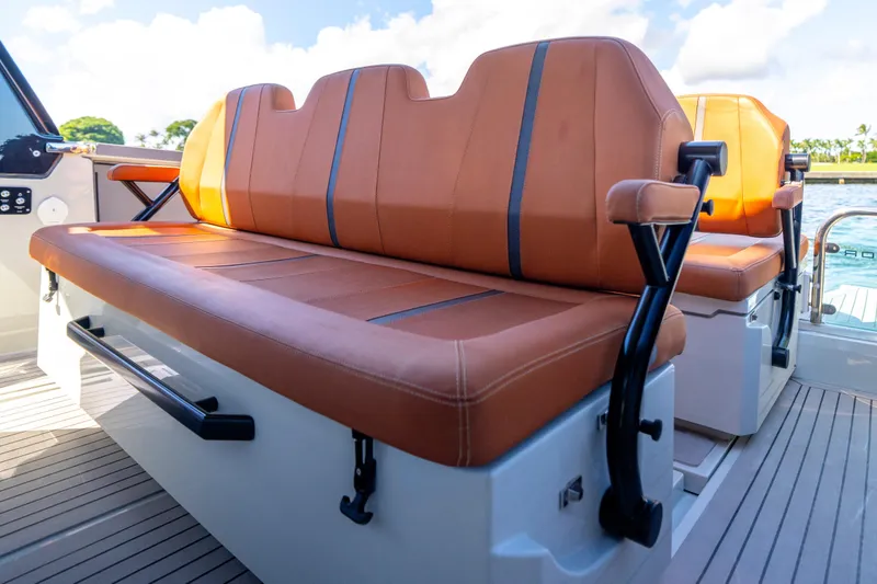 Slide: The Image of Luxurious seating on 2021 Saxdor 320 GTO boat with brown leather upholstery. - 22
