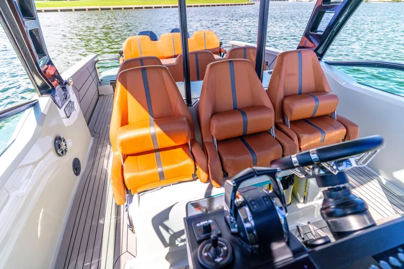 Slide: The Image of Interior of 2021 Saxdor 320 GTO boat with luxurious leather seating and modern controls. - 26