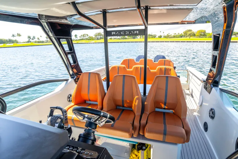 Slide: The Image of Luxurious 2021 Saxdor 320 GTO boat interior with orange seating and scenic water view. - 37