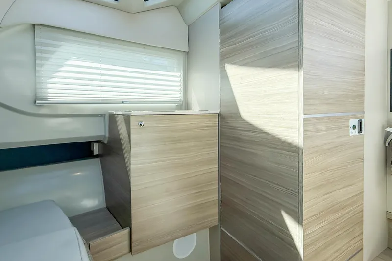 Slide: The Image of Interior of 2021 Saxdor 320 GTO boat with modern wood finish and window blinds. - 44