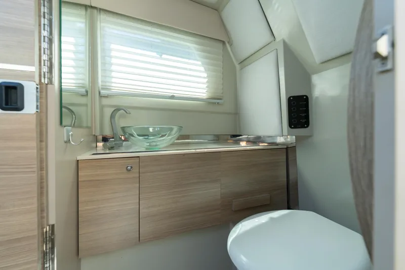 Slide: The Image of Modern bathroom interior in 2021 Saxdor 320 GTO boat, featuring sleek design and glass sink. - 45