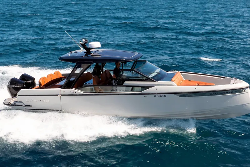 Slide: The Image of 2021 Saxdor 320 GTO cruising on open water, showcasing sleek design and powerful engines. - 49