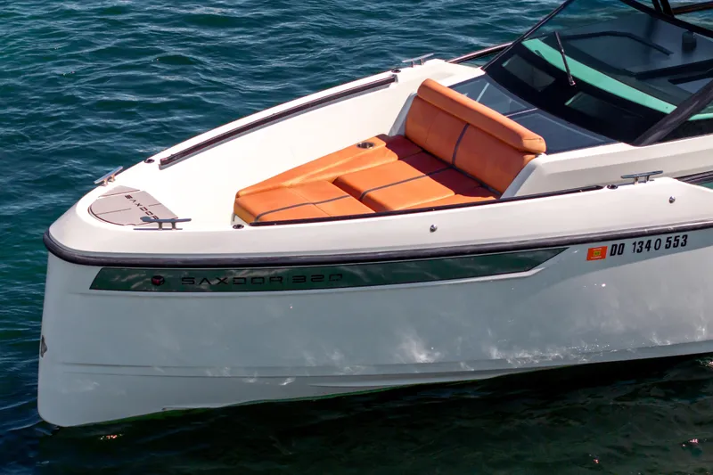 Slide: The Image of 2021 Saxdor 320 GTO boat with orange seating on blue water. - 50