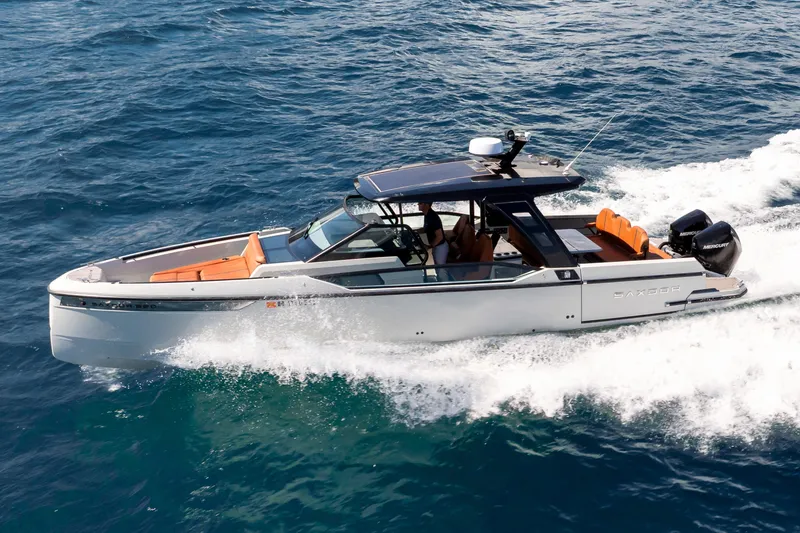 Slide: The Image of 2021 Saxdor 320 GTO cruising on open water, showcasing sleek design and powerful performance. - 51