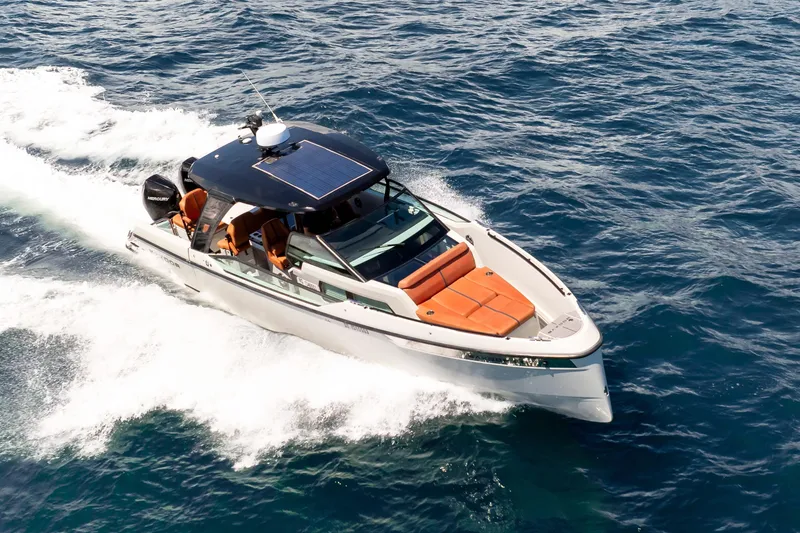 Slide: The Image of 2021 Saxdor 320 GTO cruising on open water, showcasing sleek design and luxury features. - 55