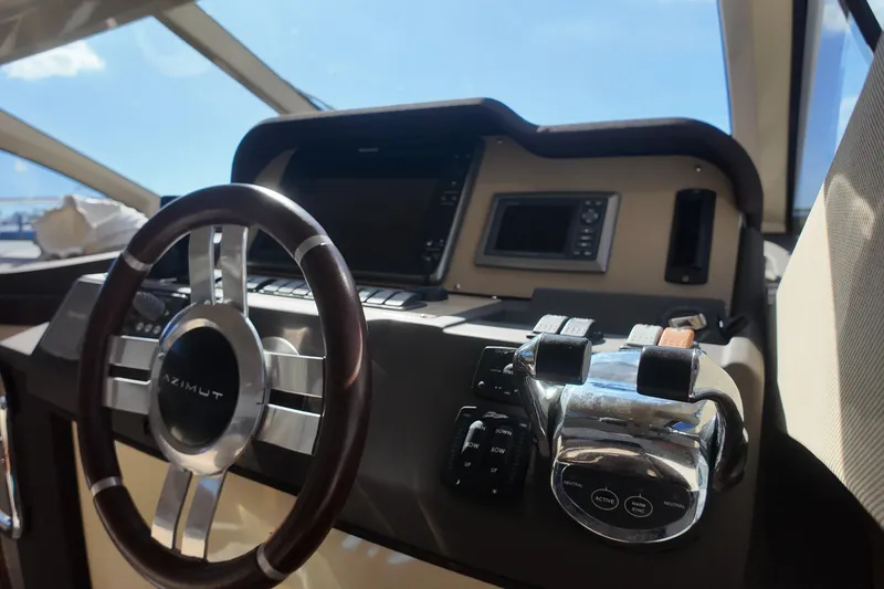 Slide: The Image of Steering wheel and controls of 2012 Azimut 40 FLY yacht cockpit. - 23