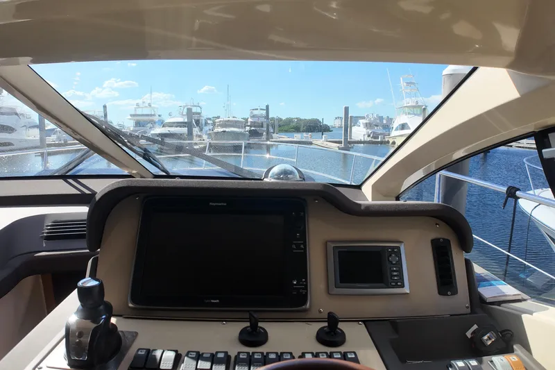 Slide: The Image of Cockpit view of 2012 Azimut 40 FLY yacht at marina, clear skies. - 24