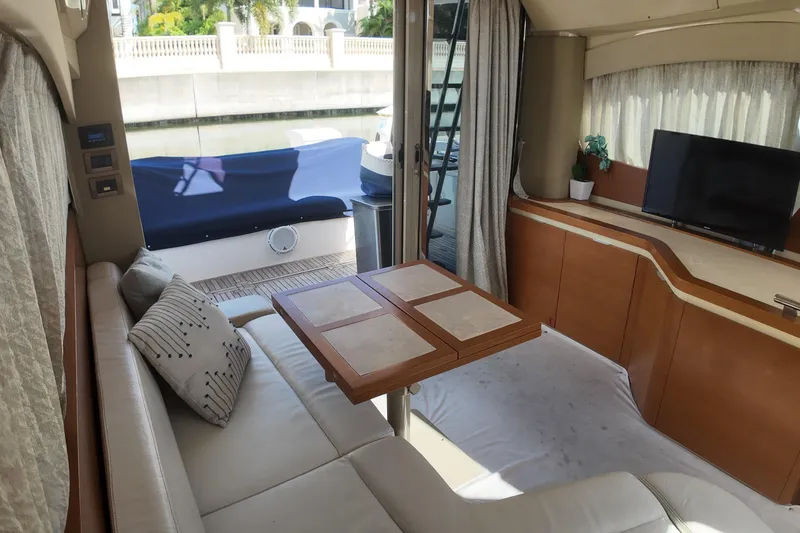 Slide: The Image of Luxurious interior of 2012 Azimut 40 FLY yacht with sofa, table, and TV. - 27