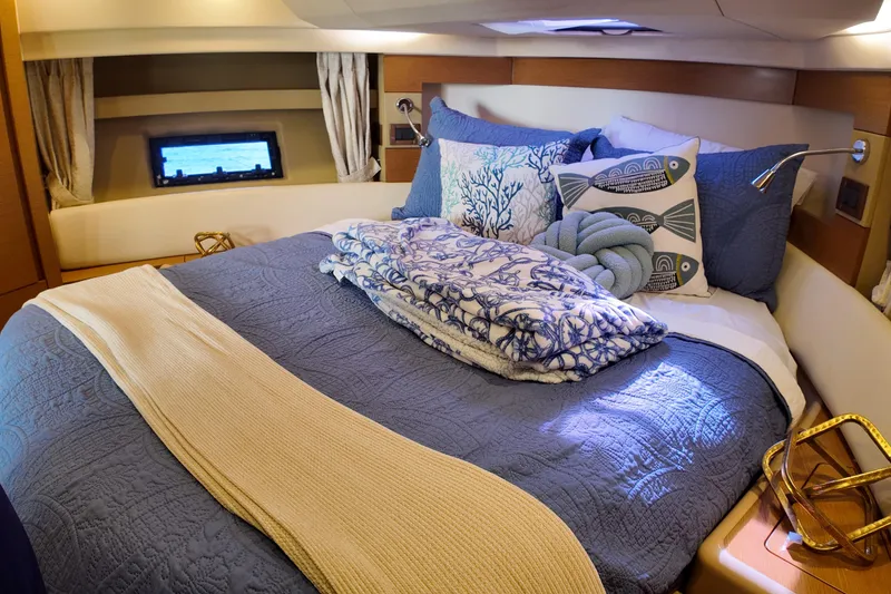 Slide: The Image of Luxurious bedroom interior of 2012 Azimut 40 FLY yacht with nautical-themed decor. - 34