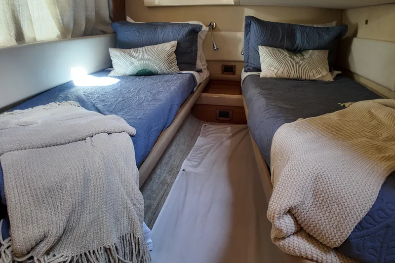 Slide: The Image of Twin beds in a cozy cabin of a 2012 Azimut 40 FLY yacht. - 36