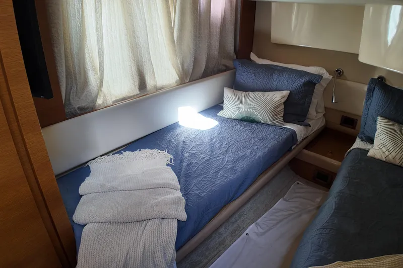 Slide: The Image of Luxurious cabin interior of 2012 Azimut 40 FLY yacht with twin beds and elegant decor. - 37